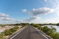 A lonely road through a dry mexican fresh water reservoir area - Progreso, Mexico Royalty Free Stock Photo
