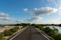 A lonely road through a dry mexican fresh water reservoir area - Progreso, Mexico Royalty Free Stock Photo