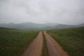 A lonely road in the green and cold steppe, Khuvsgul province Mongolia.