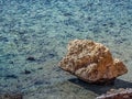 Lonely rock in the clear water of the Red Sea in Sharm El Sheikh, Egypt Royalty Free Stock Photo
