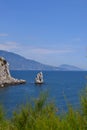 lonely rock sail in the sea