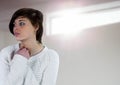 Lonely sad girl against bright window Royalty Free Stock Photo