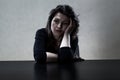 Lonely sad girl sitting at the table Royalty Free Stock Photo