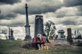 Lonely Sad Young Woman in Mourning in front of a Gravestone Royalty Free Stock Photo