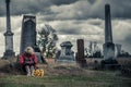 Lonely Sad Young Woman in Mourning in front of a Gravestone Royalty Free Stock Photo