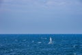 Lonely Sailboat Out On The Sea