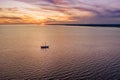Lonely sailboat in the sea at sunset aerial view Royalty Free Stock Photo