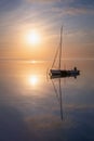 Lonely sailing boat at sunset Royalty Free Stock Photo