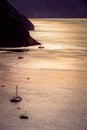 Lonely sailing boat in the vastness of aegean sea, Santorini. Royalty Free Stock Photo