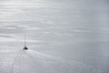 Lonely sailing boat in the vastness of aegean sea, Santorini. Royalty Free Stock Photo
