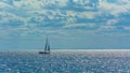 Lonely sailing yacht in the open sea Royalty Free Stock Photo