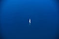 Lonely sailor on blue water