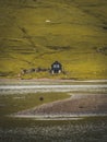 Lonely seaside house between the foggy green mountains, Faroe islands, Saksun village Royalty Free Stock Photo