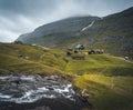 Lonely seaside house between the foggy green mountains, Faroe islands, Saksun village Royalty Free Stock Photo