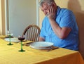 Lonely senior man at the dinner table. Royalty Free Stock Photo