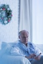 Lonely senior man on sofa Royalty Free Stock Photo