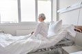 Lonely senior woman sitting in bed at hospital Royalty Free Stock Photo