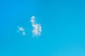 Lonely small cloud on clean blue sky background Royalty Free Stock Photo