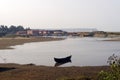 Lonely small fishing boat parked near sea shore alone Royalty Free Stock Photo