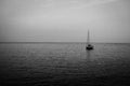 Lonely small sail boats at dusk of the coast of Italy