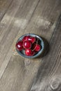 Lonely small saucer with delicious ripe cherries