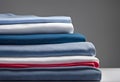 lonely stack of cotton plain clothes folded isolated on white background Royalty Free Stock Photo