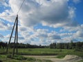 Lonely standing electric pole on a country road