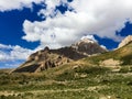 Lonely standing mountain in the background of a cloudy sky.