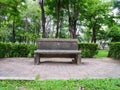 Lonely stone bench in the green park environment