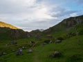 Lonely stone cottage on top of a mountain at sunset Royalty Free Stock Photo