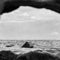 The lonely stone, which despite the water Royalty Free Stock Photo