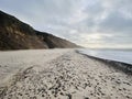 Lonely beach with cliff