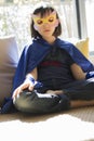 Lonely superhero child finding inner peace into thyself with mindfulness Royalty Free Stock Photo