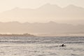 Lonely surfer at dawn