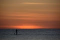 Lonely surfer at sunset over the sea, Boracay Philippines Royalty Free Stock Photo