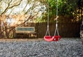 Lonely swings hanging on rope