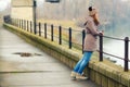 Lonely teenage girl standing outdoor on cold winter day Royalty Free Stock Photo