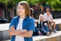 Lonely teenager standing away Royalty Free Stock Photo