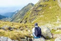 Lonely tourist exploring Fagaras Mountains near Balea Lake