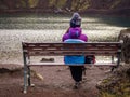 Lonely tourist girl on the bench Royalty Free Stock Photo