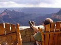 Lonely tourist looking at Grand Canyon North Rim