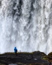 Lonely tourist near gorgeus Dettifoss waterfall