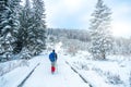 Lonely tourist start to ascend snowy mountain