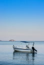 Lonely traditional greek fishing boat on sea water Royalty Free Stock Photo