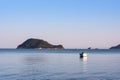 Lonely traditional greek fishing boat on sea water Royalty Free Stock Photo