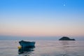 Lonely traditional greek fishing boat on sea water Royalty Free Stock Photo