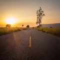 Less traveled road at sunset Royalty Free Stock Photo