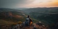 lonely traveler with backpack sitting in mountains