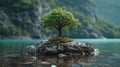 A lonely tree on a small island in a mountain lake Royalty Free Stock Photo