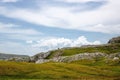 Lonely tree on the Visocica mountain range against a cloudy sky during the daytime Royalty Free Stock Photo